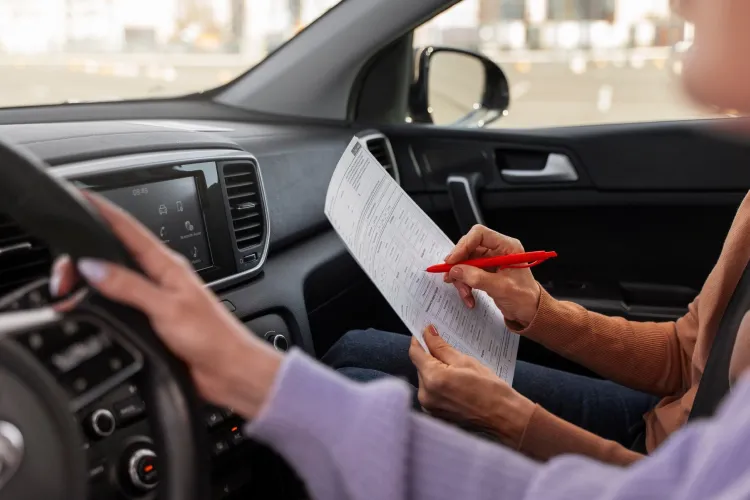 A driver checking traffic fines with their insurance agent